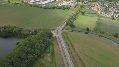 aerial drone shot of flying back over the busy road in the netherlands