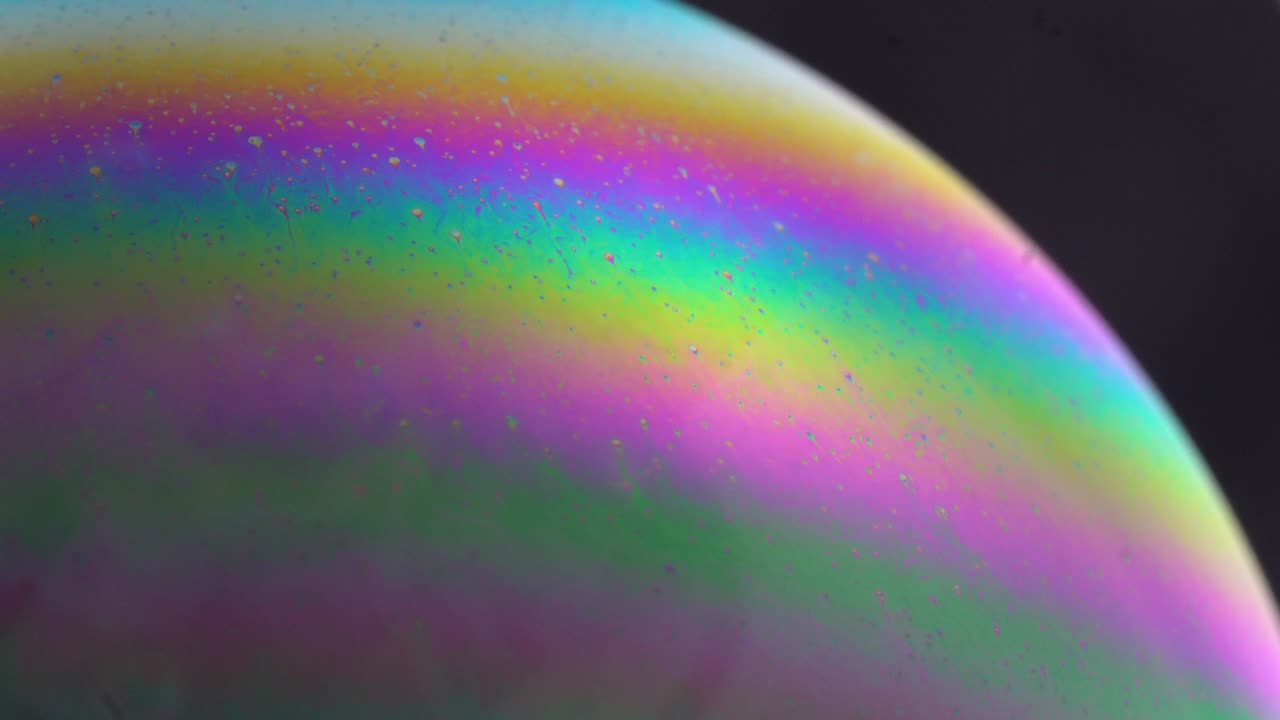 Abstract colorful soap bubbles texture, Sci-fi planet atmosphere. Macro. Slow motion.