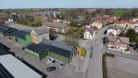 Aerial-Shot-of-a-Small-Countryside-Called-Löderup-in-South-Sweden-Skåne-With-Houses-and-Some-Farmer-Buildings