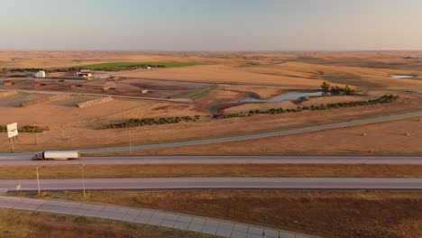 aerial view of highway and farmland at sunrise/sunset