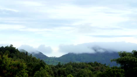 cloud slowly moving on top of mountainious area. time lapse