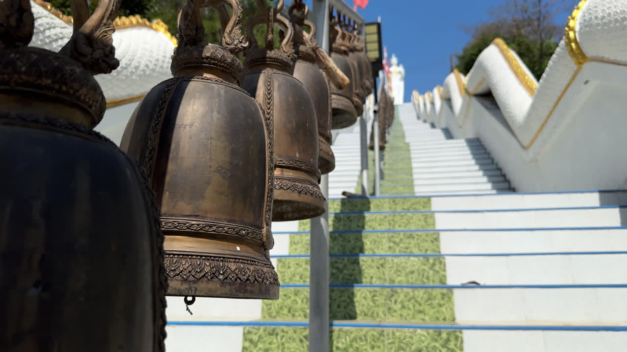 Bells On Staircase Of Wat Phlong Sawai Buddhist Temple In Rayong, Thailand. closeup shot