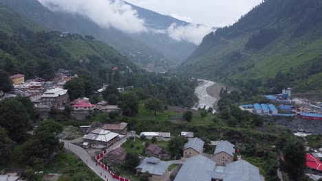 aerial pull back shot capturing balakot city in pakistan.