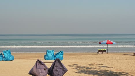 Local-beach-with-empty-chairs-in-Bali,-Indonesia
