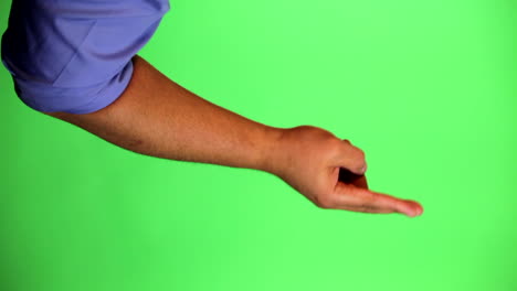 An-arm-in-front-of-a-green-screen-to-be-keyed-and-used-at-will