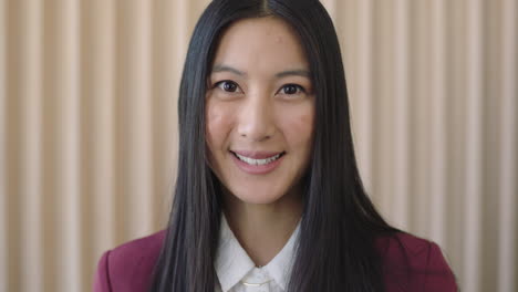 portrait-of-young-beautiful-asian-woman-smiling-friendly-looking-at-camera-wearing-formal-suit-happy-female-cute-face