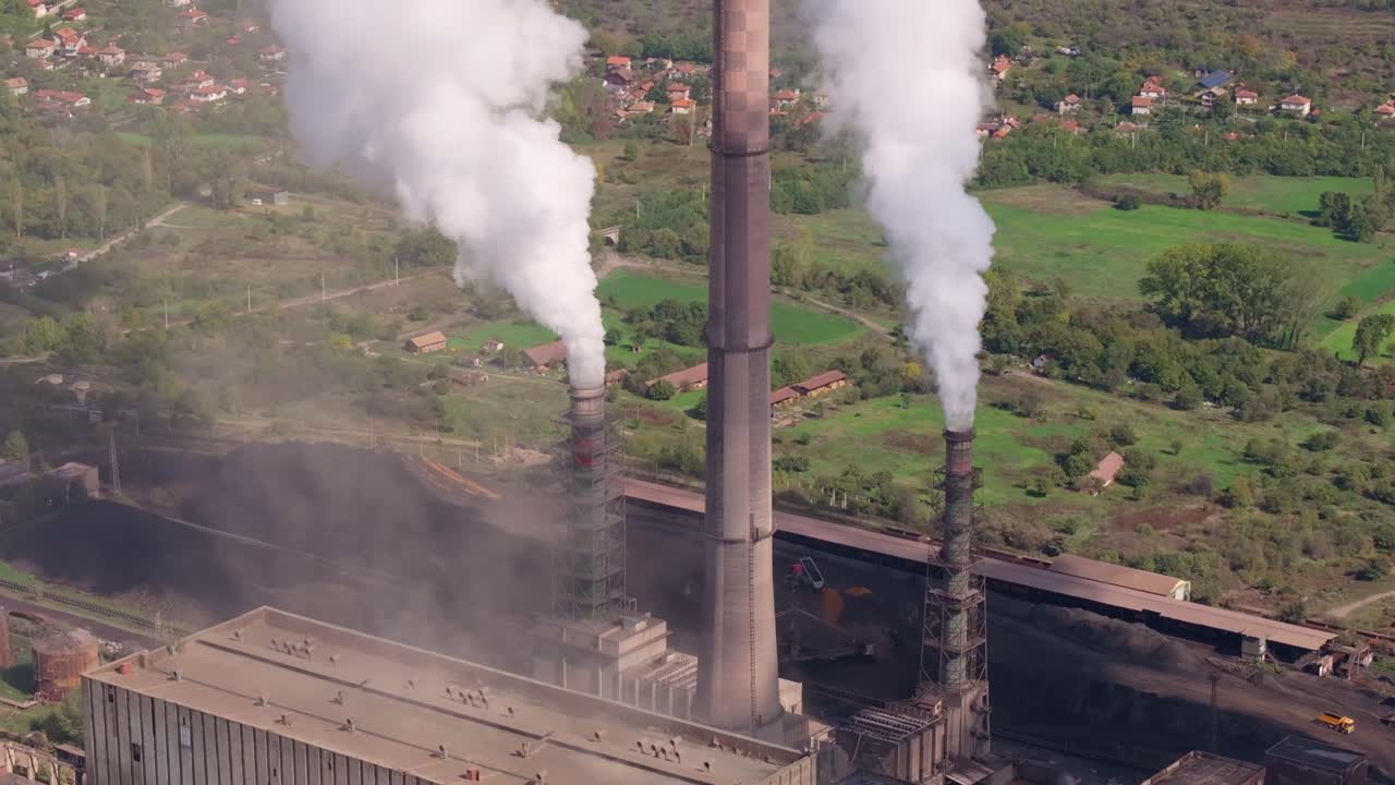 Aerial of smoke plumes over forest and fields, Bulgaria