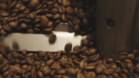 Coffee-is-mixed-at-the-end-of-the-roast,-the-beans-are-lightly-roasted