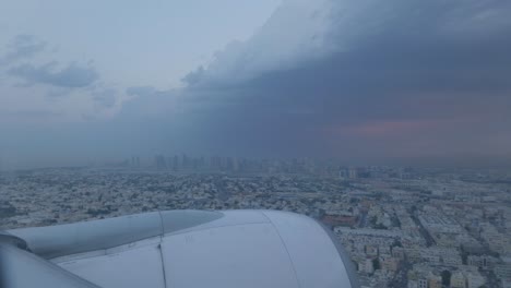 plane slowly landing in dubai during early morning sunrise