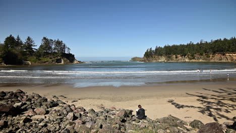 people on beach of sunset bay state park, oregon