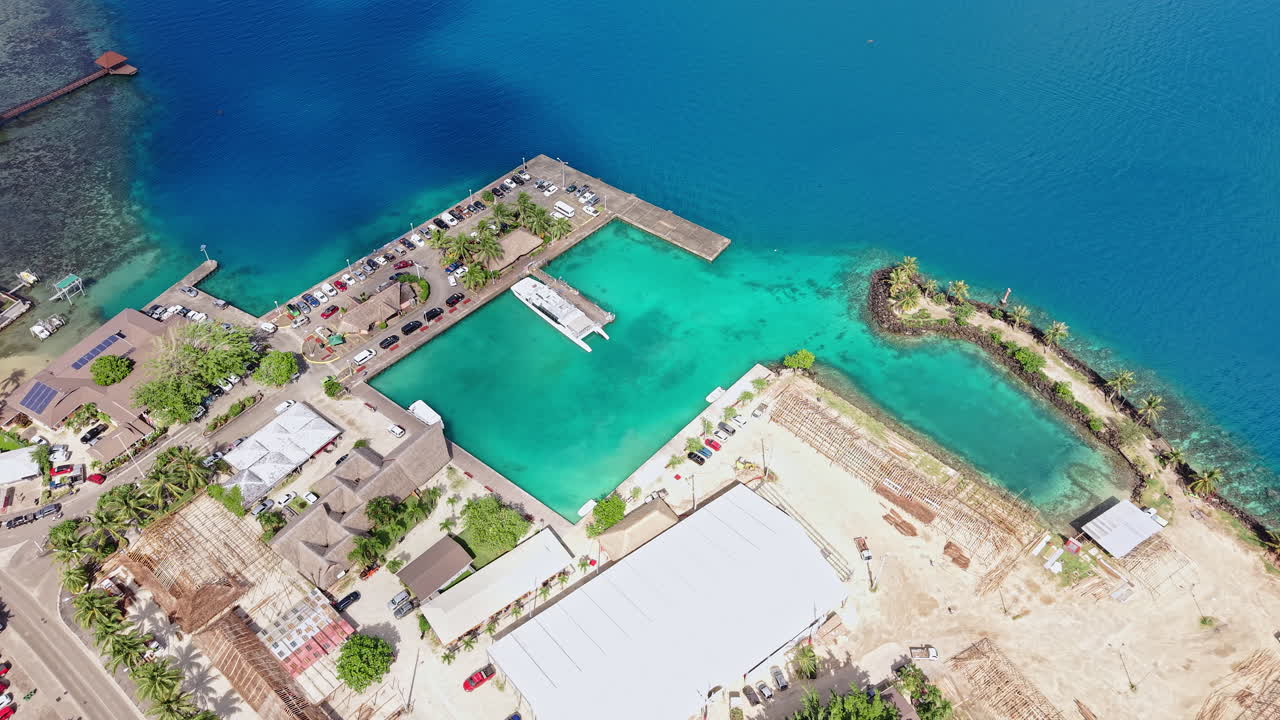 Vaitape, Bora Bora Island, French Polynesia. Aerial View of Port and Lagoon, Revealing Drone Shot