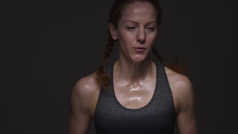 Studio-Shot-Of-Mature-Woman-Wearing-Gym-Fitness-Clothing-Doing-Cardio-Exercise-Running-On-The-Spot