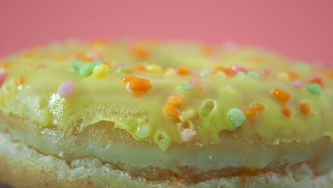 fresh lemon donut on a pink background. lemon donut