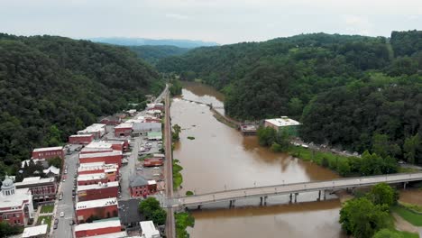 Aerial View of a Town with a River and Bridge