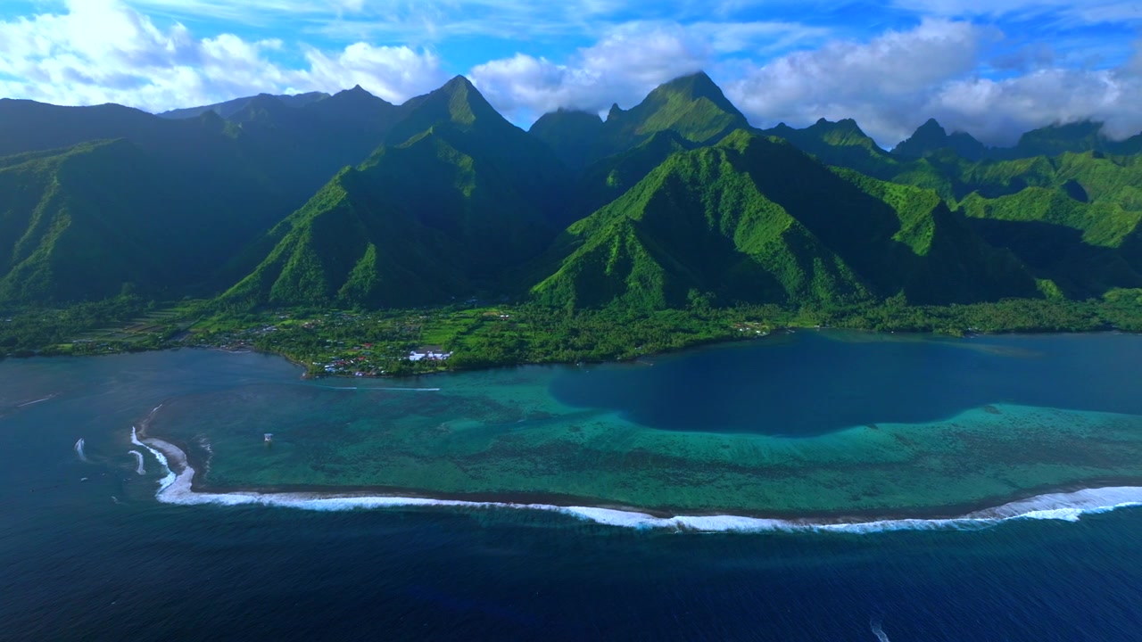 Tahiti harbor view landscape Teahupo'o surf waves sunny blue sky South Pacific Ocean coral reef aerial drone French Polynesia judge tower tour boats jet skis island Passe Havea volcano peaks pan