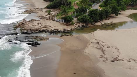 aerial slow motion footage of a beach and rocks