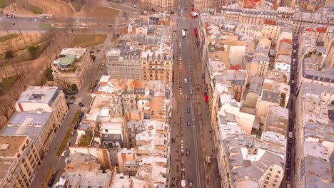 flying above the stree of paris with traffic.