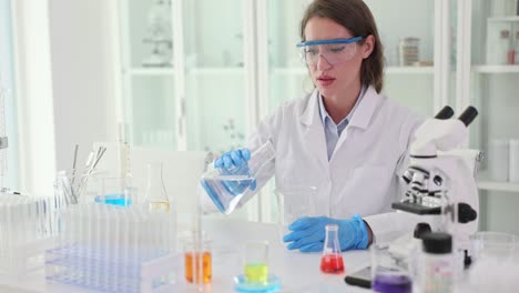 a woman conducting an experiment in a laboratory