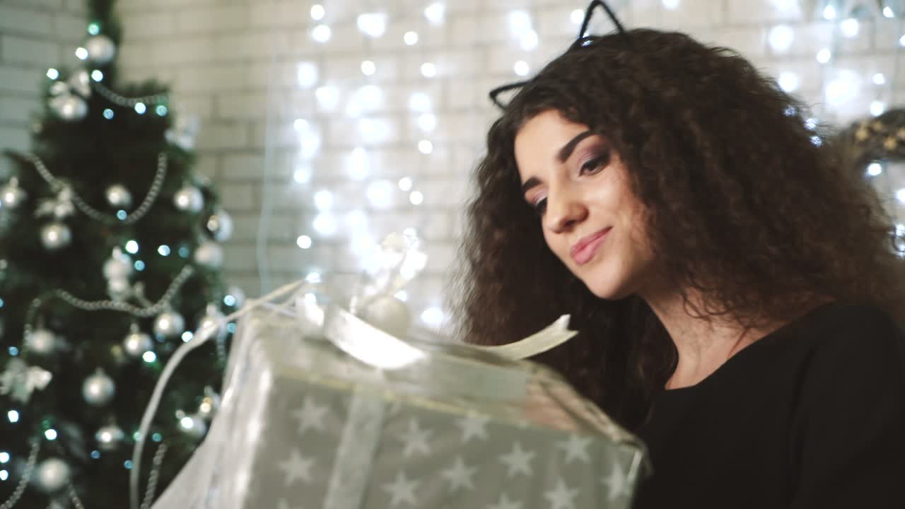 Beauty woman with christmas gift. Beautiful blonde woman with gifts at Christmas interior in room