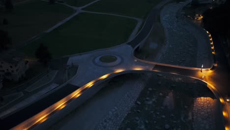 aerial view of illuminated roundabout road junction in silvaplana, switzerland