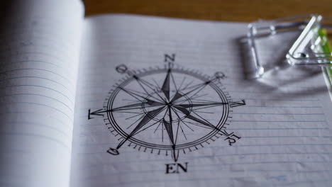compass drawing in an open notebook