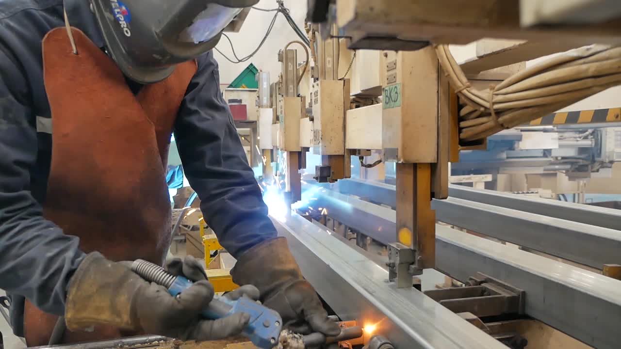 Asian Worker Wear Protection Working in Heavy Metal Factory, Editorial