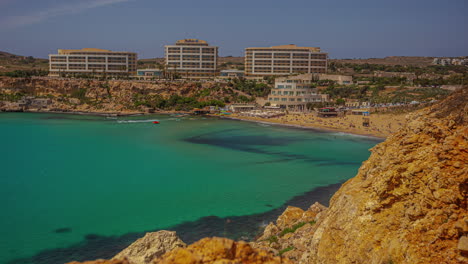 golden bay beach and resort area of ghajn tuffieha, malta - time lapse