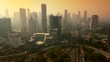 jakarta, indonesia. september 14, 2017: exotic aerial scenery of central business district of semanggi with highway bridge and skyscrapers at dusk