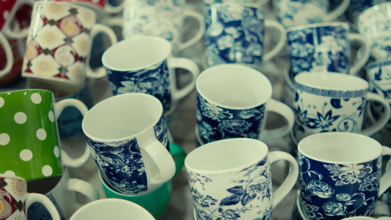 Colorful mugs on display creating a vibrant and lively atmosphere