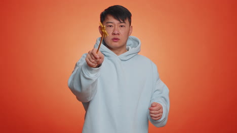 magician wizard asian man gesturing with magic wand making wish come true casting magician spell