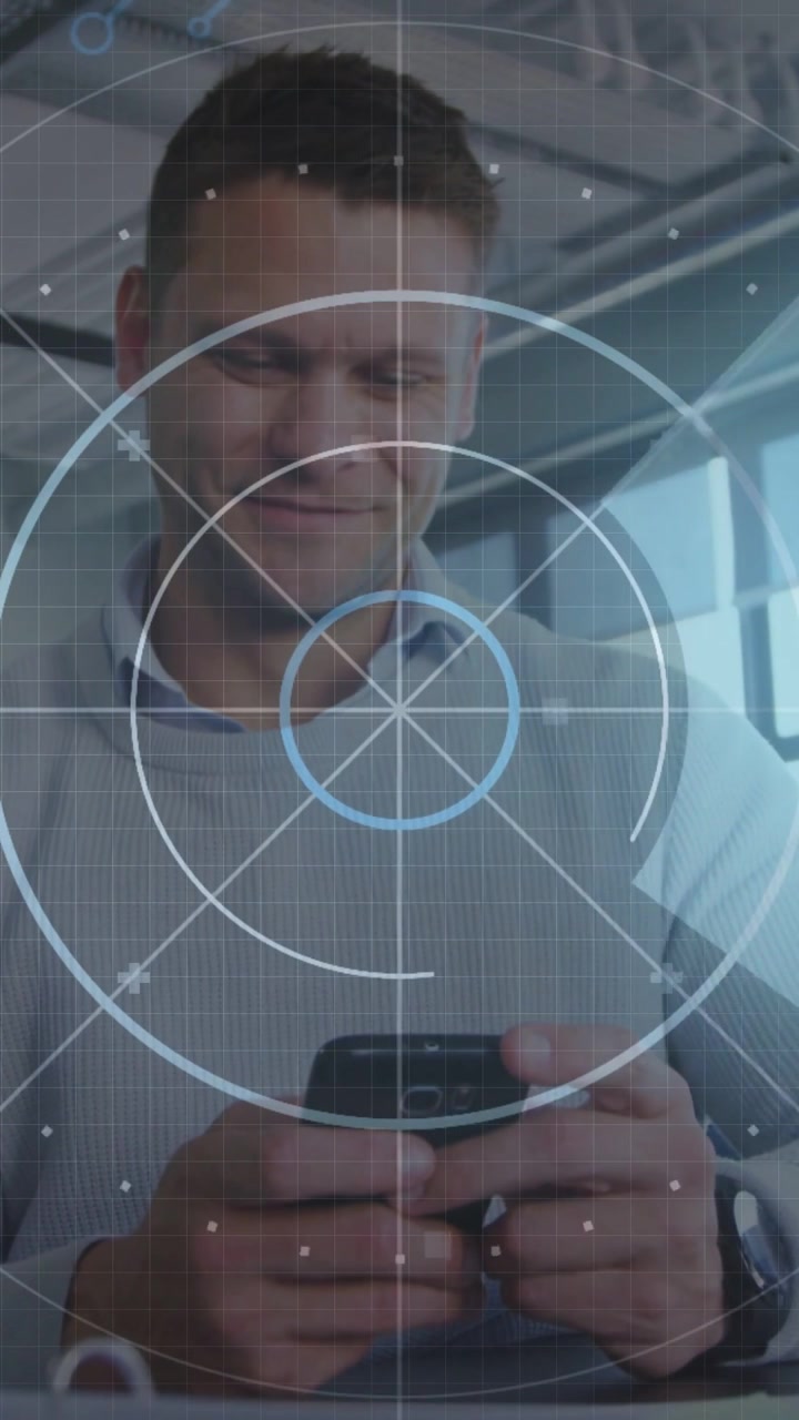 Vertical video: Man tapping phone and activating HUD, grabbing pen while reviewing business notes