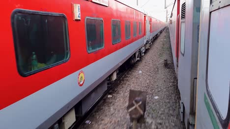 passenger-train-running-on-track-crossing-each-other-from-opposite-direction-at-morning-video-is-taken-at-new-delhi-railway-station-on-Aug-04-2022