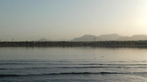 foggy sunrise at red sea coastline in sharm el sheikh, egypt