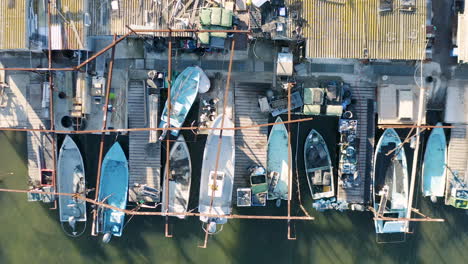 vertical aerial view over fishing boats in the port du barrou sète etang de thau