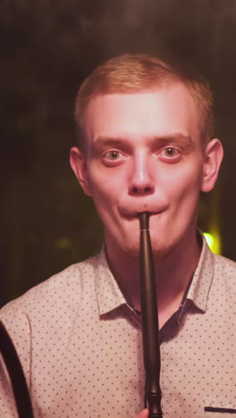 young man smoking hookah