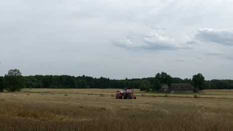 time-lapse-of-rye-wheat-harvesting-with-tractor-working-on-field-farm-planation