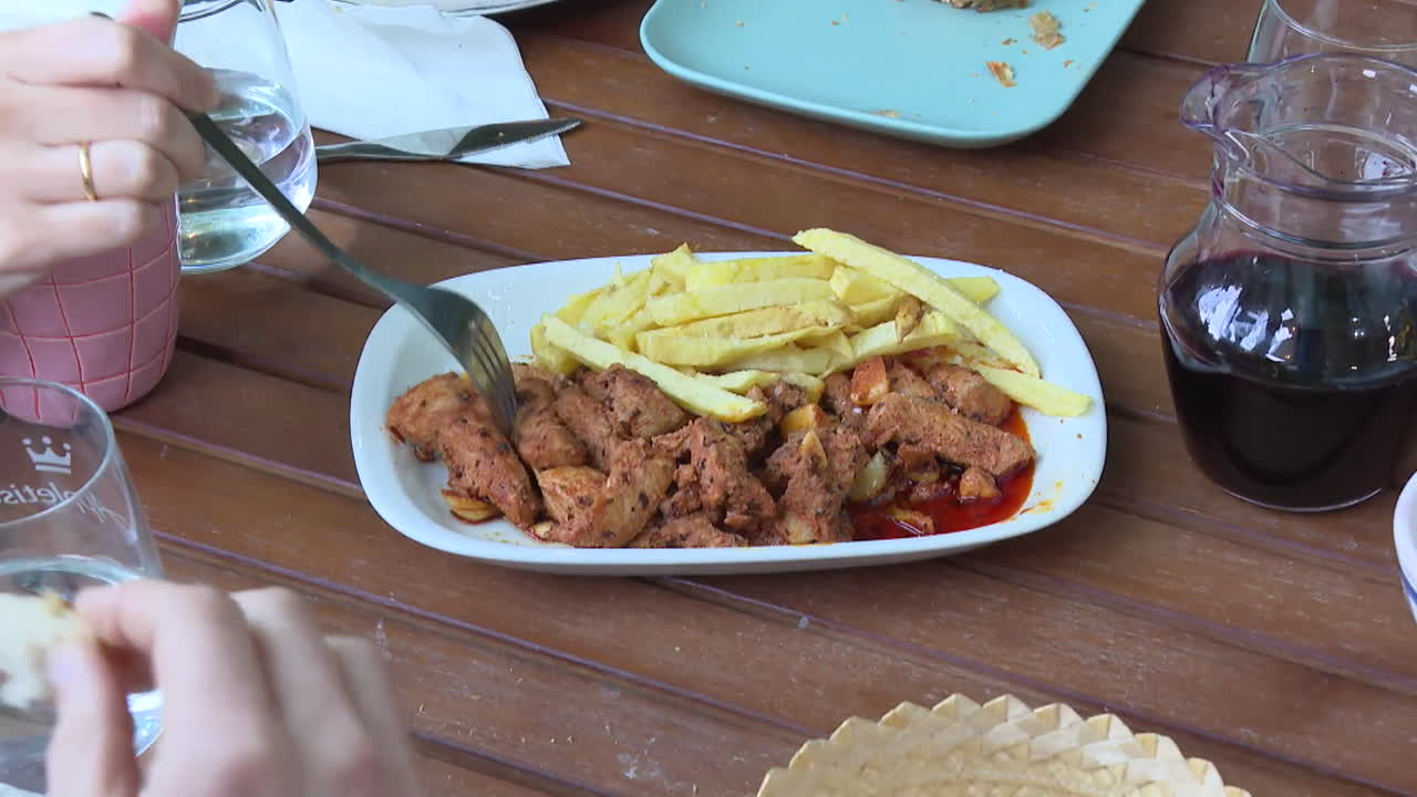 Chicken and Fries Meal at Outdoor Restaurant