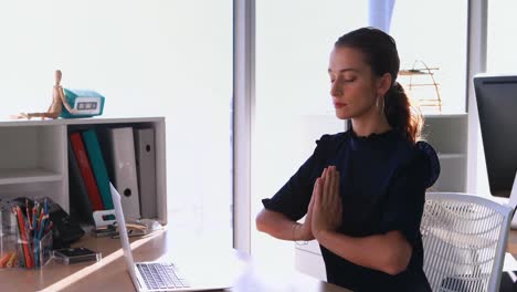 female executive doing yoga 4k