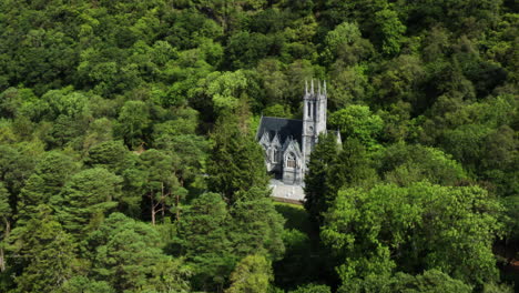 aerial dolly in shot of the victorian style kylemore abbey in ireland