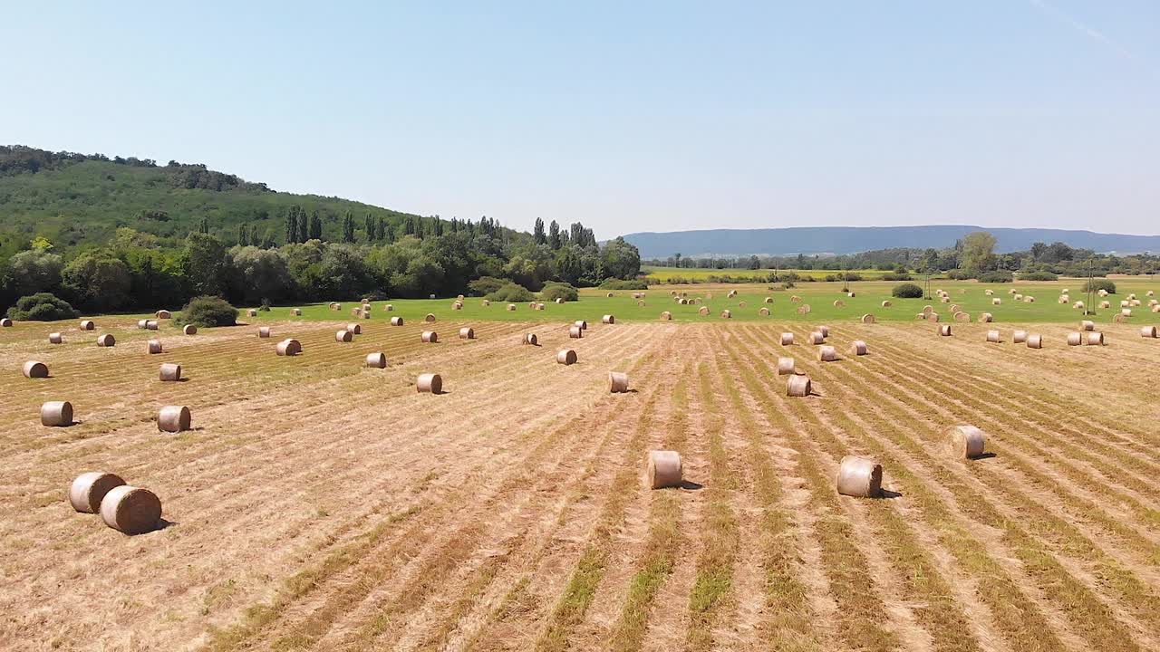 Aerial drone footage, hay bales on the meadow in Hungary