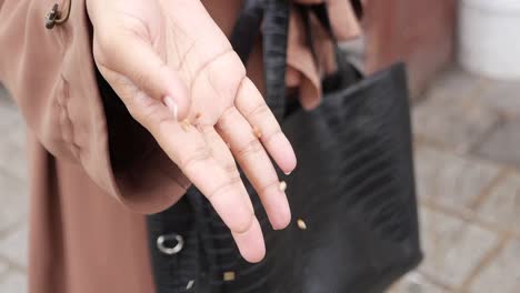 woman's hand holding wheat grains