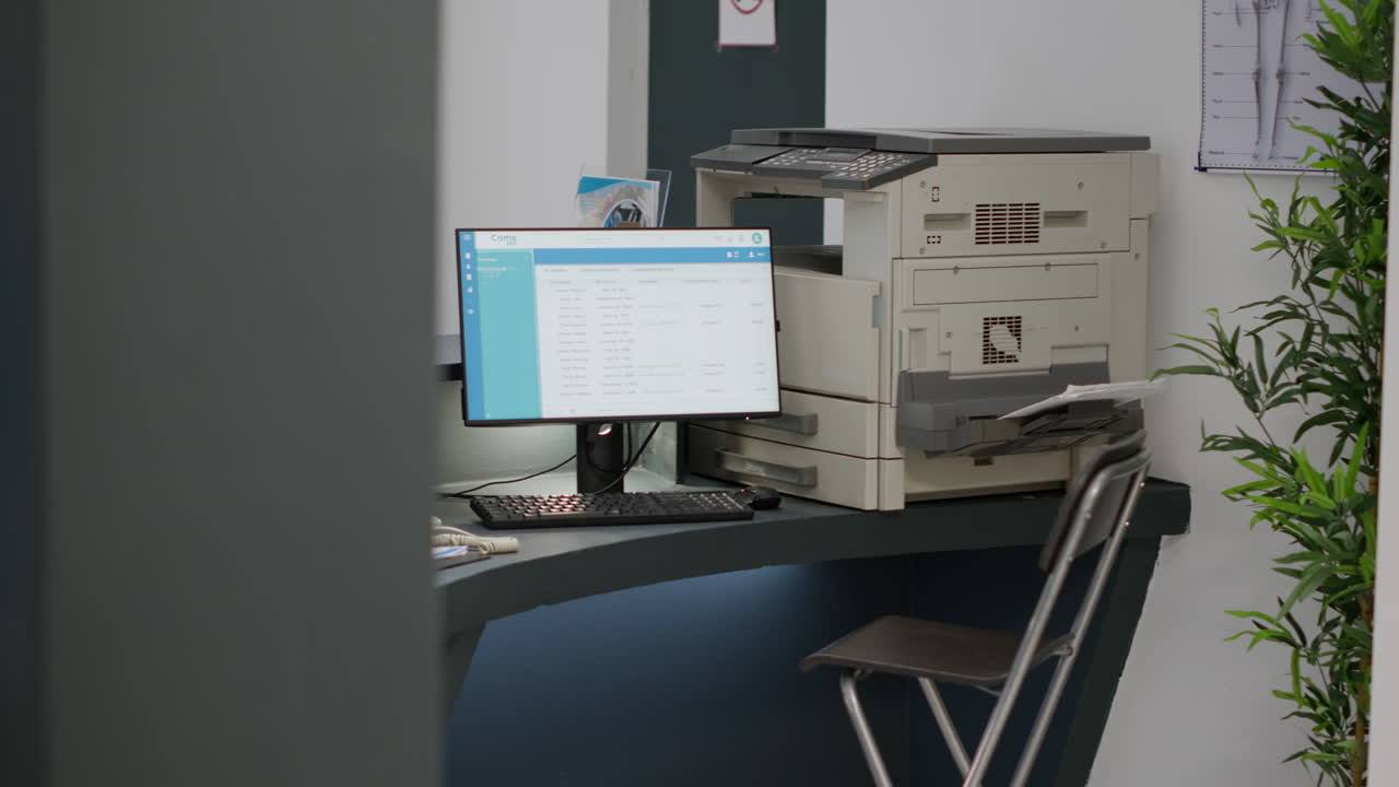 Reception desk with computer and photocopier