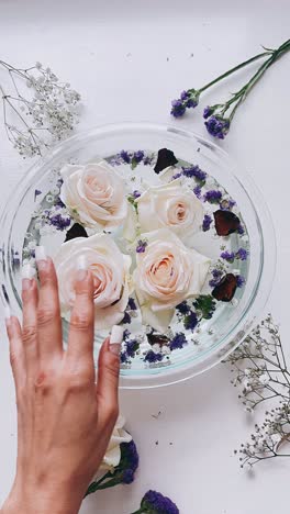 floating roses in a glass bowl