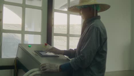 worker operating industrial machine