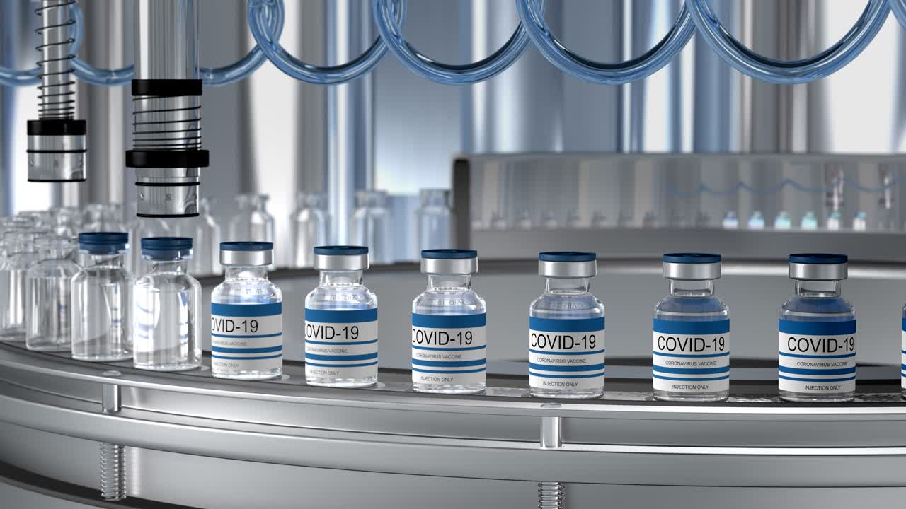 SARS-COV-2 COVID-19 Mass production of coronavirus vaccine, a machine pours the vaccine, seals bottle caps into ampoules moving along a pharmaceutical conveyor belt in a research laboratory