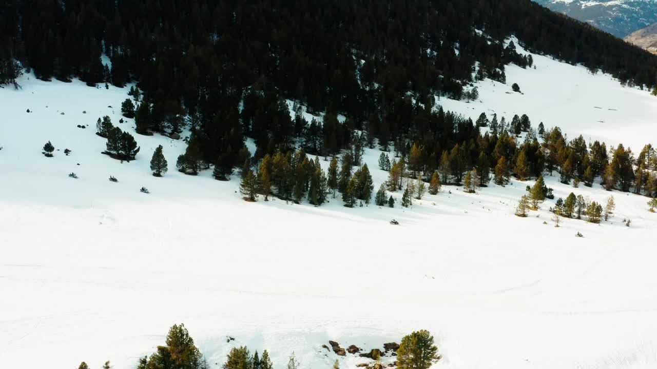 A group of snowmobilers coming down from the slopes in Andorra