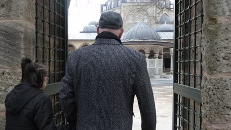 entering mosque courtyard