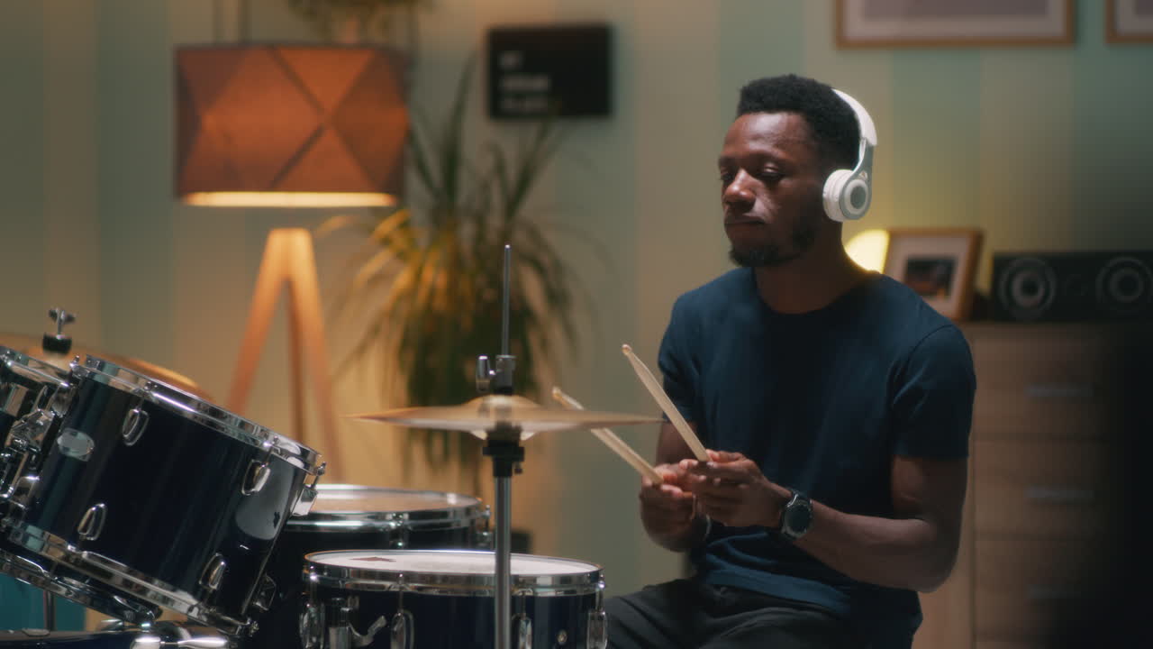 African American Drummer Discussing Rhythmic Pattern at Rehearsal Shot of African American Conga Drummer Discussing Rhythmic Pattern with other Musician while Rehearsing New Composition