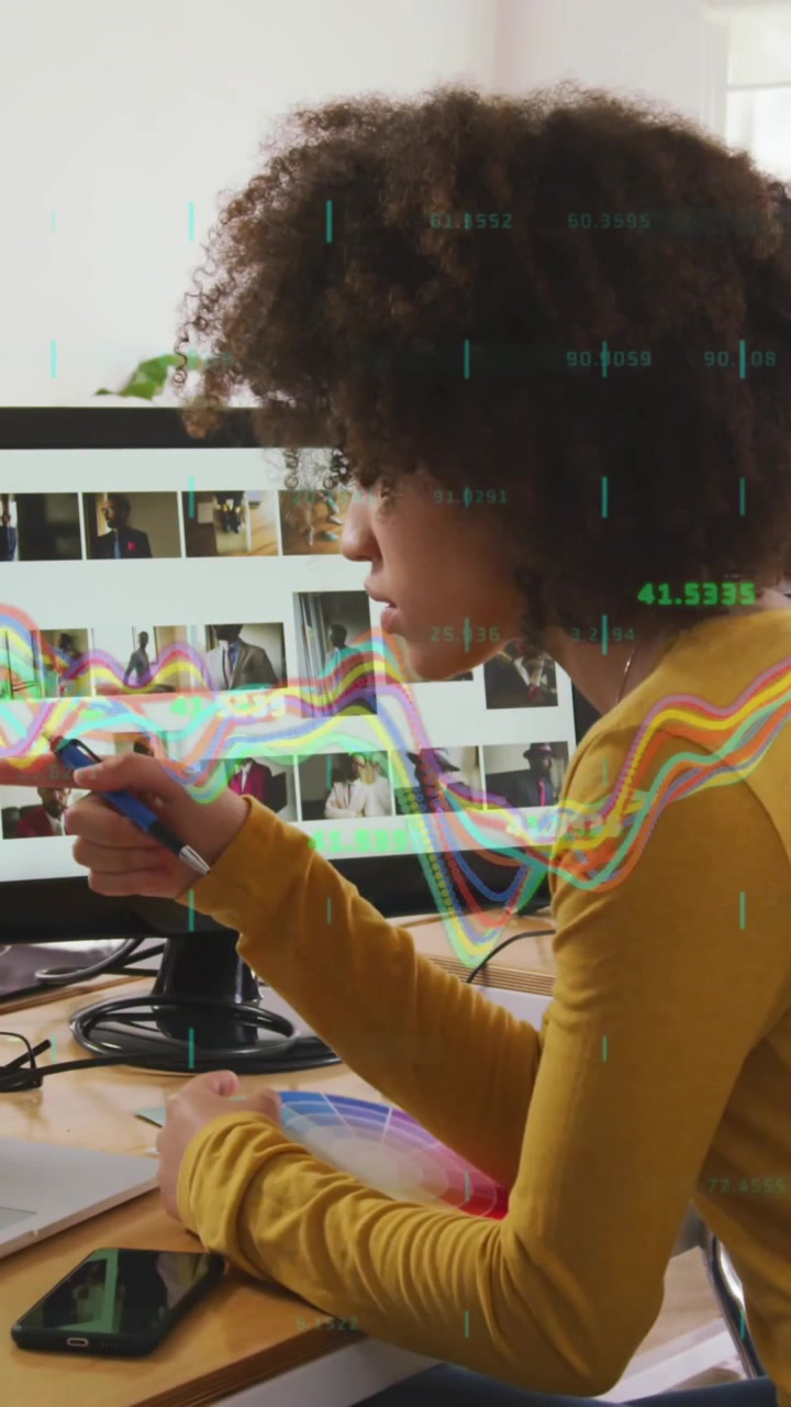 Composite of financial data processing over businesswoman using computer in office