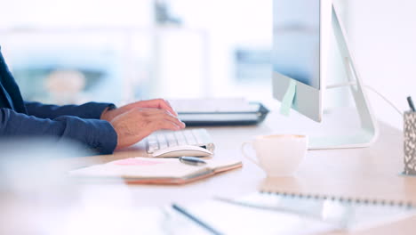 Mans-hands-typing-on-computer-keyboard